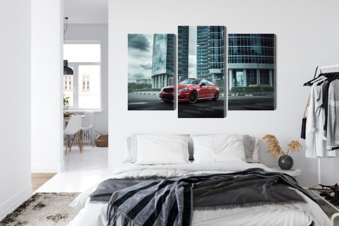 Obraz Wieloczęściowy Czerwony Samochód Na Tle Nowoczesnych Drapaczy Chmur Obraz Wieloczęściowy Czerwony Samochód Na Tle Nowoczesnych Drapaczy Chmur