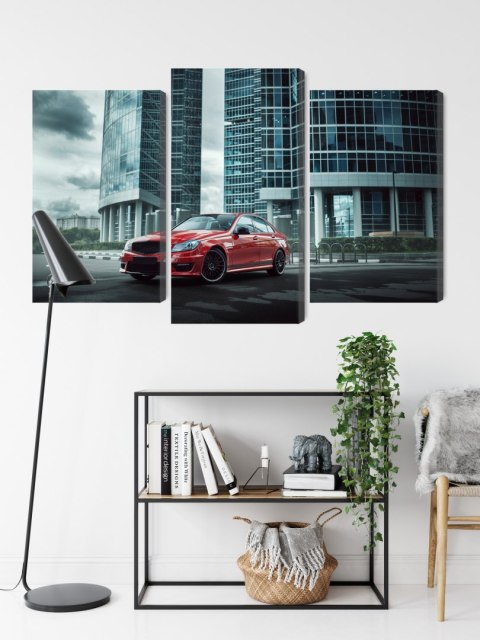 Obraz Wieloczęściowy Czerwony Samochód Na Tle Nowoczesnych Drapaczy Chmur Obraz Wieloczęściowy Czerwony Samochód Na Tle Nowoczesnych Drapaczy Chmur