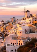 Plakat Malowniczke Miasteczko Oia O Zachodzie Słońca
