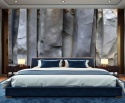 Sypialnia z fototapetą imitującą pionowe warstwy skały w ciemnych odcieniach szarości.