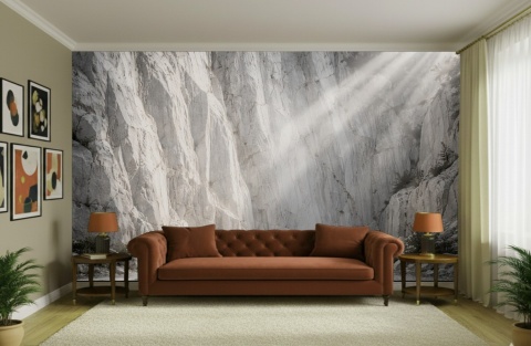 Jasna fototapeta przedstawiająca skalny kanion w świetle słonecznym nad sofą w nowoczesnym salonie.